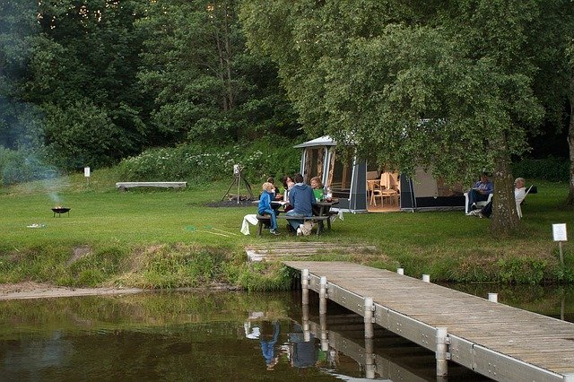 family campers while enjoying outdoor meals