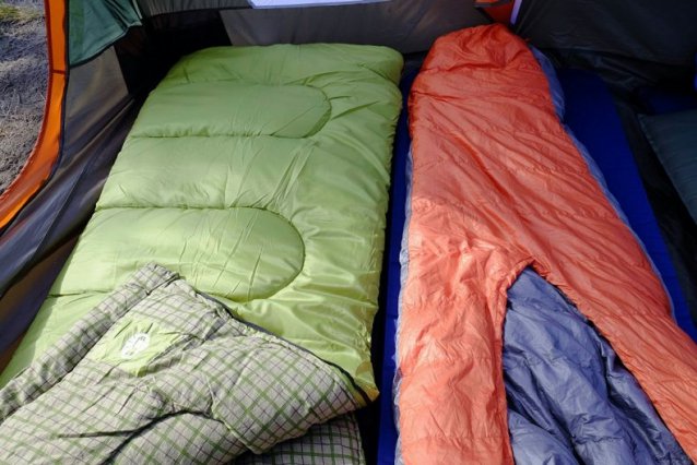 two types of sleeping bag inside the camping tent